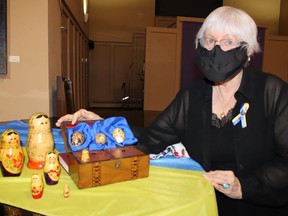 One of Command Performance members, Barb Harris, has family connections to Ukraine. She brought along this display of folk art to a rehearsal, featuring skillfully coloured eggs, especially the one she is pointing to, used at the wedding of her grandmother in Ukraine more than 100 years ago. JACK EVANS PHOTO