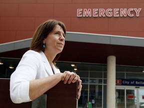 Quinte Health Care president and CEO Stacey Daub sits outside the emergency department of Belleville General Hospital in 2021. Despite decreasing rates of COVID-19, local hospitals remain strained by high demand and fewer staff, resulting in longer waits, especially for emergency and surgical care and diagnostic imaging.