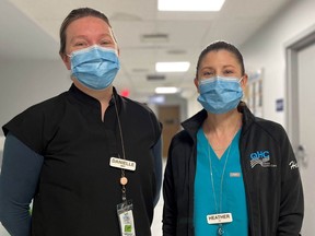 Imaging technologists Danielle Sangiuliano, left, and Heather Wright stand in a hallway of Belleville General Hospital. They are the May recipients of the Quinte Health Care board's Values in Action award.