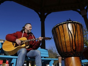 With a drum close at hand, Cooper resident Terri Clancy plays a guitar in a gazebo near the Madoc Public Library, a satellite location of the Stirling Musical Instrument Lending Library, or MILL. The MILL needs votes to win money from the McDougall Community Contest.