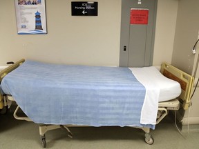 A bed stands in a hallway outside the regional intensive care unit of Belleville General Hospital. Voters in Thursday's provincial election will play a role in the future of Ontario's health care system.