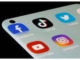 FILE PHOTO: Facebook, TikTok, Twitter, YouTube and Instagram apps are seen on a smartphone. Disinformation commonly circulates on social media, especially during election campaigns.