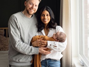 Josh Melfi and Marshneill Abraham hold their four-month-old son Celle Ren Melfi, who is named after the small town in Italy where Josh's grandfather was born.
