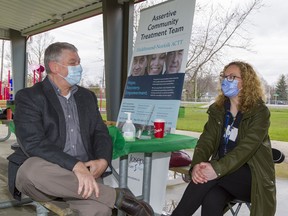 John Ranger, assistant executive director of the Brant Haldimand Norfolk chapter of the Canadian Mental Health Association chats with Candice Babbey, manager of the Assertive Community Treatment Team of Haldimand Norfolk on Monday May 2, 2022. Mental Health Week was launched with an information fair at Kinsmen Park in Port Dover with CMHA and a number of partner agencies present.