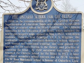 A plaque outlines the history of the first provincial school for blind students up to 1974 when it was renamed the W. Ross Macdonald School.