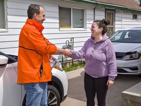 Brantford-Brant NDP candidate Harvey Bischof meets Grand Street resident Lisa Frey while canvassing on in Brantford.