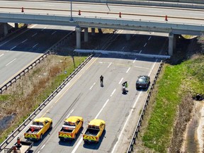 Highway 403 in both directions was closed in Brantford on Monday after a large slab of concrete from the Wayne Gretzky Parkway overpass fell onto the westbound lanes. Brian Thompson