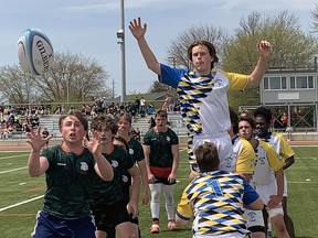 North Park Collegiate's Hugh Spence takes a pass during a lineout in a senior boys high school rugby game against Brantford Collegiate Institute on Tuesday at Bisons Alumni North Park Sports Complex.