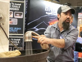 Jamie Robbins demonstrates a Showerme product Saturday afternoon at the Brantford Lifestyle Spring Home Show.  CHRIS ABBOTT