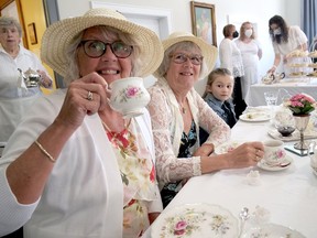 Susan Rechil (left) enjoys her traditional high tea Saturday at the Langford Community Church Victorian Tea, a fundraiser for Langford Community Church Women's Group.