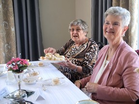 Jill Black (left) and Wendy Lindsay were among the 53 participants Saturday at the Langford Community Church Victorian Tea.  This year's tea was separated into a two-day event.  CHRIS ABBOTT