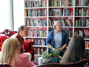 NDP Leader Andrea Horwath and Harvey Bischof, the NDP candidate for Brantford-Brant, chat with elementary school teacher Inge MacLeod of Paris and her daughter Mya at Dog-Eared Cafe in Paris on Thursday where Horwath announced details of her party's universal mental health plan.