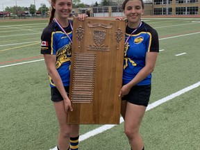 BCI captains Annalise Wey (left) and Grace Jacklyn hold the CWOSSA plaque after defeating Owen Sound District Secondary School in the final on Friday at Bisons Alumni North Park Sports Complex. Expositor Photo