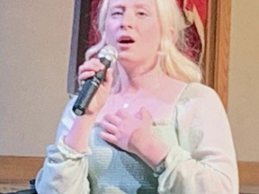 Jade Ondrik, a secondary school student at W. Ross Macdonald School, sings during a ceremony Thursday marking the school's 150th anniversary.  Ondrik, of Waterdown, was the top prize winner at this year's Brant Music Festival.  Vincent Ball