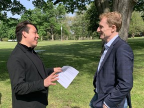 Mark Hill, elected chief of Six Nations of the Grand River, chats with Marc Miller, federal Minister of Crown-Indigenous Relation, this week during a visit to form Mohawk Institute residential school in Brantford. The minister participated in an apple tree planting ceremony with school survivors. Vincent Ball