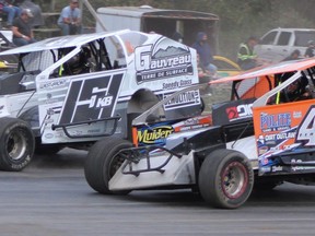 Johnathon Ferguson (no. 44) battles for a position during the 2021 running of the Applefest Shootout Weekend at Brighton Speedway. 
Jim Clarke/ Clarke Motorsports Communications/First Draft Media