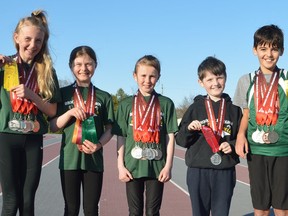 Brockville Legion Track and Field Club members Lilah Kinch, Aubrey Durant, Avery Kinch, John Sivers and Miles Williams display the medals and ribbons won at recent Athletics Ontario U10 and U12 indoor championships held in Toronto.
Tim Ruhnke/The Recorder and Times