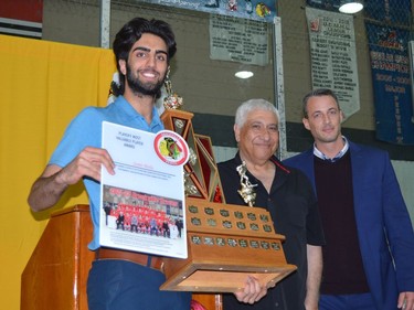 Braves goaltender Sami Molu receives the team's 2022 playoffs MVP award from club CEO Hani Greiss and Brockville head coach Randy Jones.
Tim Ruhnke/The Recorder and Times