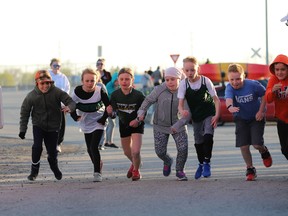 Youngsters in the 8-9 age group get moving after race director Michel Larose says 'go' during the kids fun run event at the 2022 Fort Town Night Run at the Port of Johnstown on Saturday.
Tim Ruhnke/The Recorder and Times