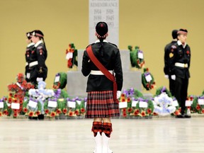 The Essex and Kent Scottish Regiment Sgt. Major David Larmond (centre) prepares prepares to dismiss the honour guard around the cenotaph at the  Remembrance Day ceremony at the John D. Bradley Convention Centre in Chatham on Monday Nov. 11, 2013. (File photo/Postmedia)
