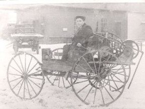Young Bill Gray at the tiller of his 'Buggymobile', circa 1905.