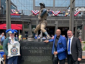Hall of Fame pitcher and Chicago Cubs legend Fergie Jenkins, a Chatham native, had his statue unveiled outside Wrigley Field on May 20. He's shown with Chatham-Kent Mayor Darrin Canniff, as well as town crier George Sims. (Submitted)