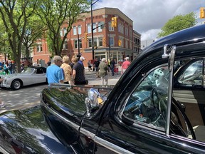 Thousands of people were walking through downtown Chatham on May 28 while taking in RetroFest, which featured hundreds of older and vintage automobiles. In the foreground is a 1947 Ford. Peter Epp photo