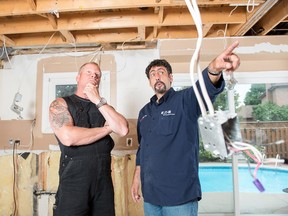 Home building expert Mike Holmes (left) says homeowners need to understand the electricity in their home and to have it updated to meet safety regulations. Holmes Group photo