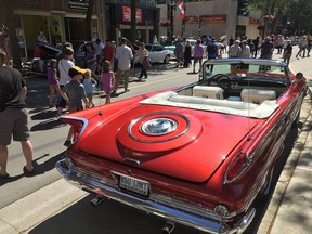 Thousands of people attended RetroFest in 2019 in downtown Chatham. The car show is making a return this year, on May 27, 28. In the foreground is Phil and Joanne Duquette's 1960 Chrysler WIndsor convertible. The Duquettes are from Chatham. Peter Epp/Chatham This Week