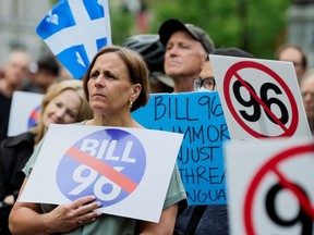 Opponents of Quebec's French-language law Bill 96 protest in downtown Montreal, May 26, 2022.