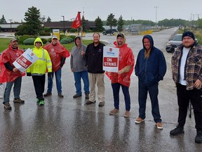 Enbridge Gas employees, who are members of Unifor Local 999, which represents more than 100 storage, transmission and operations in Ontario, went on strike at 12:01 a.m. Wednesday. This group of employees are on the picket line at the Enbridge Gas Dawn Hub, north of Dresden, in south Lambton County. PHOTO Ellwood Shreve/Chatham Daily News