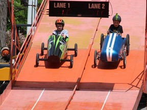 Jonah Legroulx, 9, left, of Wallaceburg, and Adam Wilson, 10, of Chatham, were among the many area youth who enjoyed racing the Soapbox Derby during RetroFest in Chatham on Saturday.  PHOTOEllwood Shreve/Chatham Daily News.