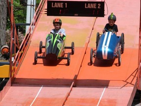 Jonah Legroulx, 9, left, of Wallaceburg, and Adam Wilson, 10, of Chatham, were among many local youngsters who enjoyed taking part in the Soapbox Derby at RetroFest in Chatham on Saturday. PHOTOEllwood Shreve/Chatham Daily News.