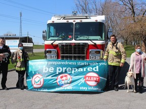 Promoting Emergency Preparedness Week are (from left) Cornwall Fire Services deputy chief Leighton Woods, acting captain Steve Parthenais, firefighter Jack Burelle, and SDG Animal Centre manager Carol Link.Photo in Cornwall, Ont. Todd Hambleton/Cornwall Standard-Freeholder/Postmedia Network