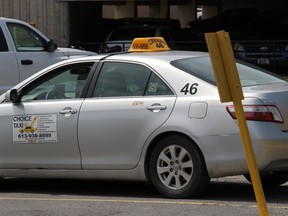 A cab in a designated taxi parking area at Cornwall Square on Friday afternoon. Photo in Cornwall, Ont. Todd Hambleton/Cornwall Standard-Freeholder/Postmedia Network