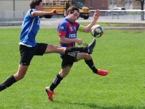 A St. Lawrence Saints player battles La Citadelle defender Caleb Filliol for ball control in SDG high school senior boys' soccer action on Thursday afternoon. Photo on May 12, 2022, in Cornwall, Ont. Todd Hambleton/Cornwall Standard-Freeholder/Postmedia Network