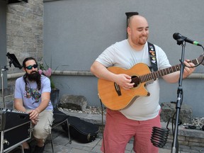 From left, Ryan O'Neil and Keegan LaRose of O'Neil Studios performing at Pommier Square, as a part of the Downtown BIA's Downtown Spring Festival on Saturday May 21, 2022 in Cornwall, Ont. Shawna O'Neill/Cornwall Standard-Freeholder/Postmedia Network