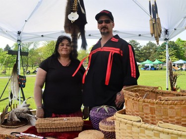 From left, Catherine Lazore Benedict and Dave Coyote Benedict, displaying various handmade items on Saturday May 21, 2022 in Cornwall, Ont. Shawna O'Neill/Cornwall Standard-Freeholder/Postmedia Network