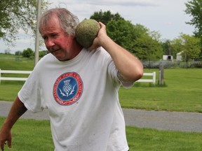 Lee MacKinnon with his 17-pound practice stone, found on a beach in Nova Scotia during a vacation. Photo on Tuesday, May 24, 2022, in Maxville, Ont. Todd Hambleton/Cornwall Standard-Freeholder/Postmedia Network
