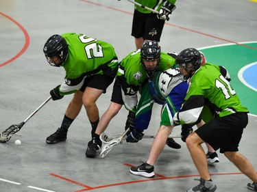 Cornwall Celtics Joshua Fickes, left, scoops up the ball while a few teammates keep a Peterborough Lakers player tied up on Sunday May 22, 2022 in Cornwall, Ont. The Lakers won 13-4. Robert Lefebvre/Special to the Cornwall Standard-Freeholder/Postmedia Network