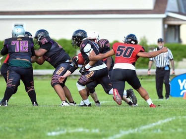 A Cornwall Wildcats player gets a hand on a Peel Panthers runner during play on Saturday May 28, 2022 in Cornwall, Ont. The Wildcats won 57-0. Robert Lefebvre/Special to the Cornwall Standard-Freeholder/Postmedia Network