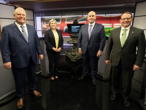 Ontario Progressive Conservative Party Leader Doug Ford, left to right, Ontario New Democratic Party Leader Andrea Horwath, Ontario Liberal Party Leader Steven Del Duca and Green Party of Ontario Leader Mike Schreiner pose for a photo ahead of the Ontario party leaders' debate, in Toronto, Monday, May 16, 2022.