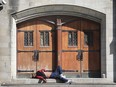 WINDSOR, ON. OCTOBER 8, 2019. -- A homeless man sleeps in front of The Downtown Mission on Tuesday, October 8, 2019. For files. (DAN JANISSE/The Windsor Star) homeless, poverty, downtown