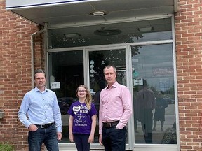 From left, Josh Alexander, Gutsy Walk honorary chairperson Claire Moore and Luke Simpson of Durham Furniture Inc., who donated $1,000 toward the upcoming Gutsy Walk on June 5.