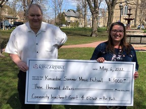 Doug Kennedy, representing the Municipality, presents a cheque for $3,000 to Claire Andrusiak, representing the Kincardine Summer Music Festival, which was one of 29 local non-profit organizations that received funding from the Municipality.