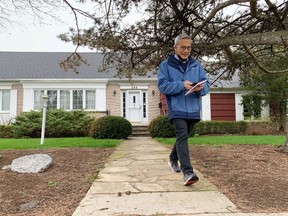 Ted Hsu, Liberal candidate for Kingston and the Islands, walks away from a house while canvassing in the Strathcona Park neighbourhood in Kingston on May 2.