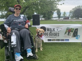 Dinah Cotter and her dog guide, Ellie, in Doug Fluhrer Park on Sunday for the Pet Valu Walk for Dog Guides.