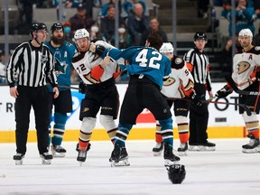 Hunter Drew (72) of the Anaheim Ducks and Jonah Gadjovich (42) of the San Jose Sharks fight in the third period of an NHL game on April 26, 2022, in San Jose, Calif. It was Kingston, Ont., native Drew's NHL debut.