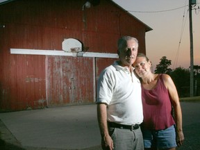 Ron and Minnie Grozelle stand in front of the basketball net where their son, Joe, spent years working on the form that made him a varsity player at Royal Military College in Kingston. He disappeared from the school in 2003 at age 21 and his body was found three weeks later.