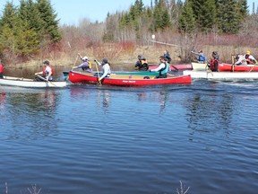 An enthusiastic group headed out from Sesekinika for the annual High Water Run canoe and kayak races.
